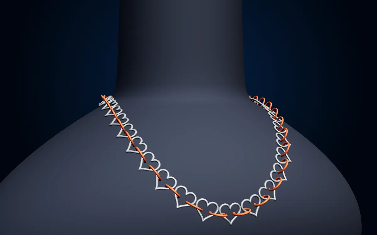 Silver hearts with orange rolo links between them
